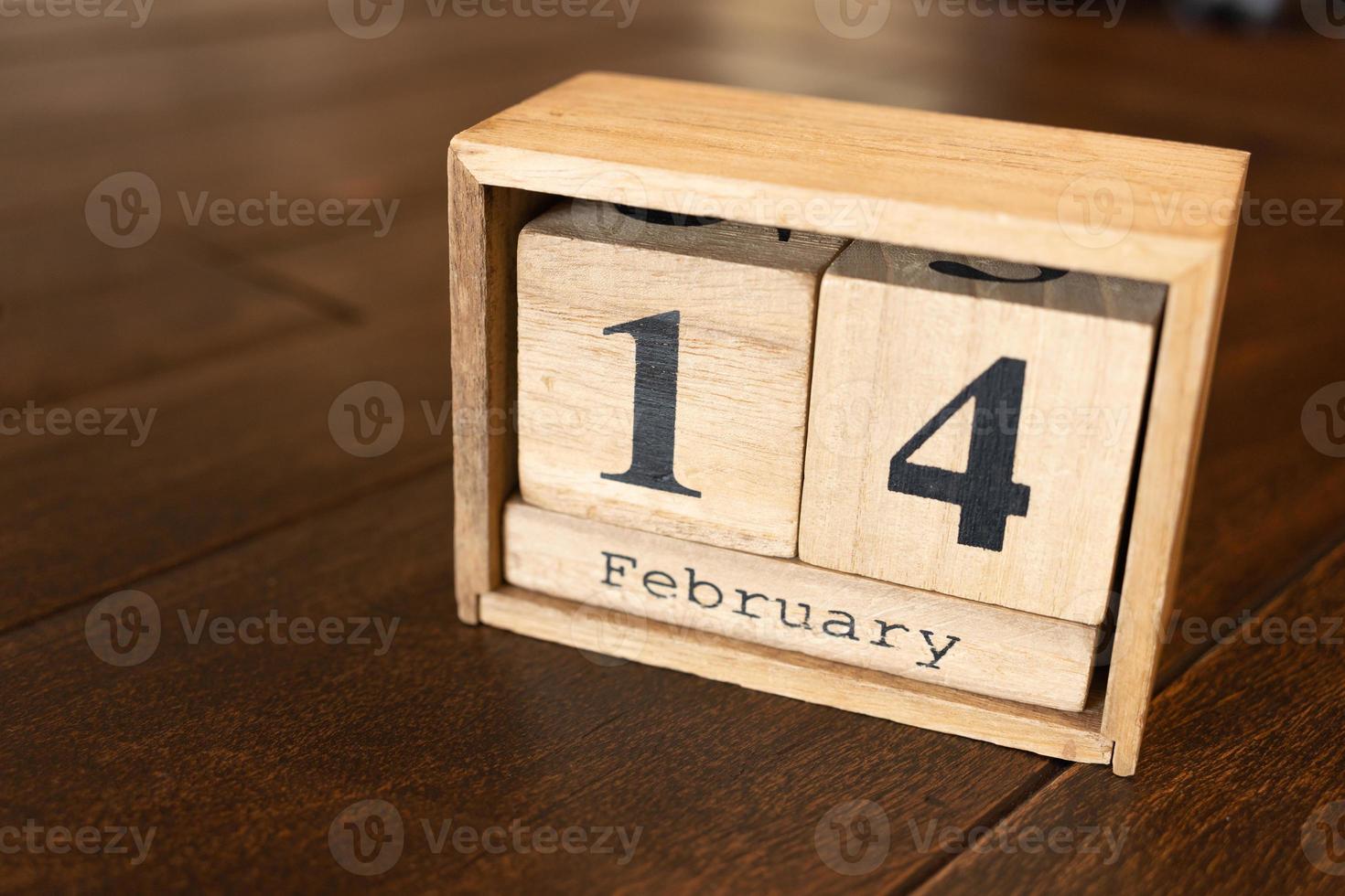 Feb 14 Happy Valentine's Day. February 14 calendar date text on wooden blocks with customizable space for text or ideas. Copy space and calendar concept. photo