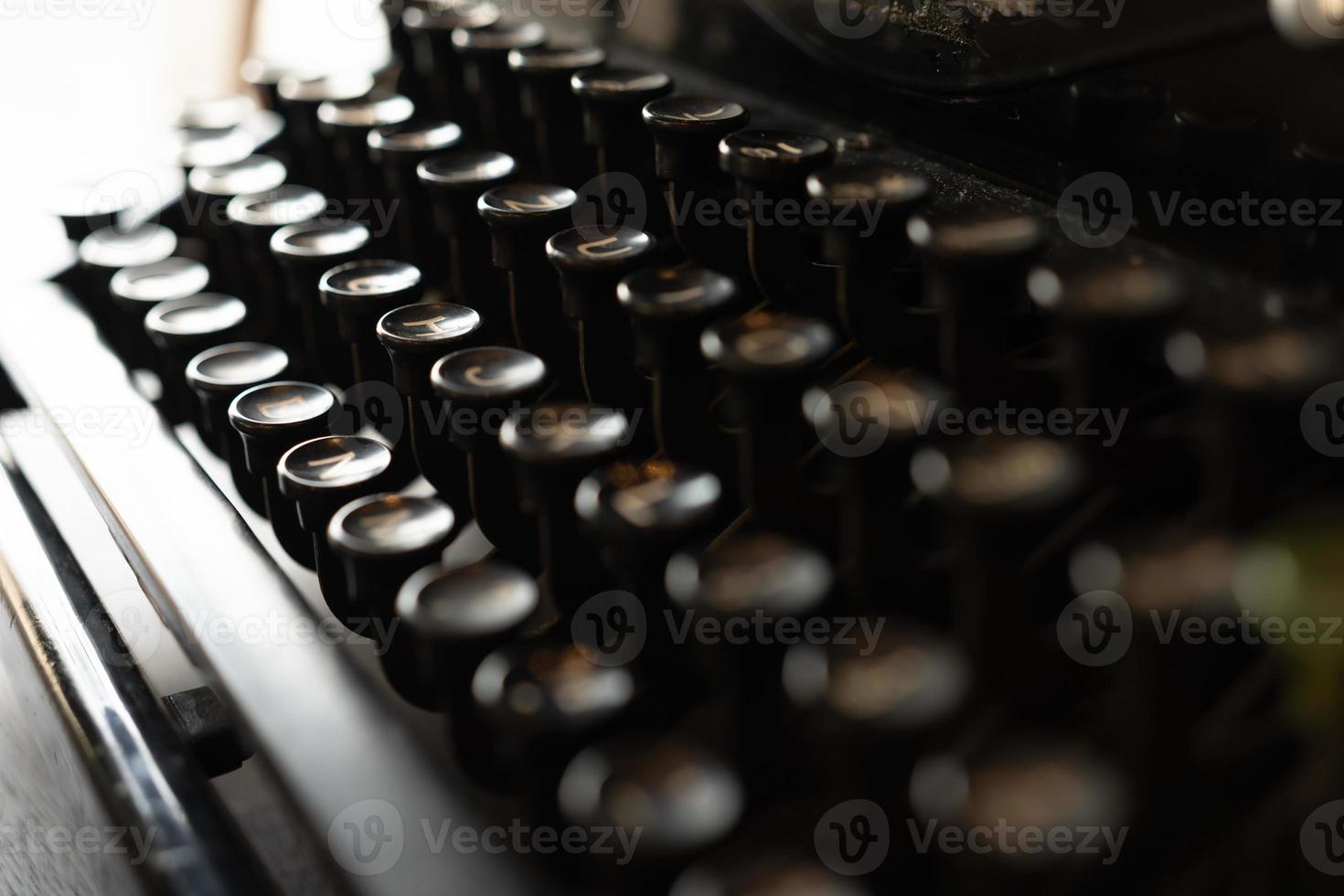 vintage typewriter keys with selective focus. Antique Typewriter. Vintage Typewriter Machine Closeup Photo. photo