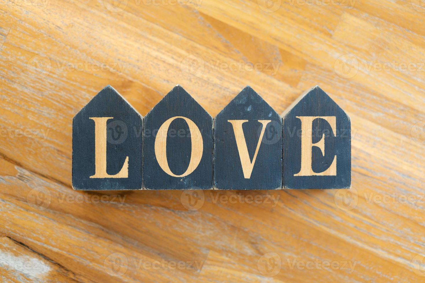 Word love. Love blocks. The word love formed with small wooden blocks. photo