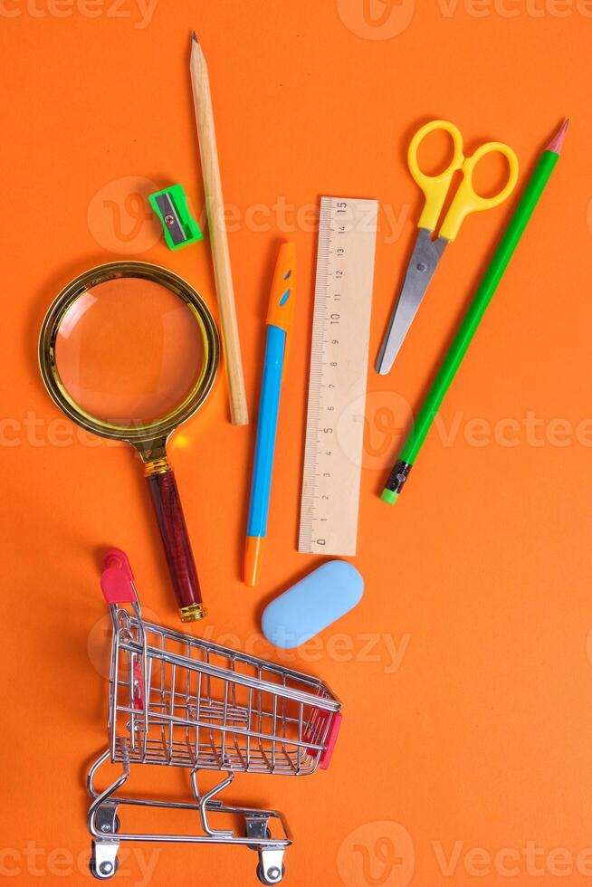 Shopping basket with office and school supplies.Concept preparing for
