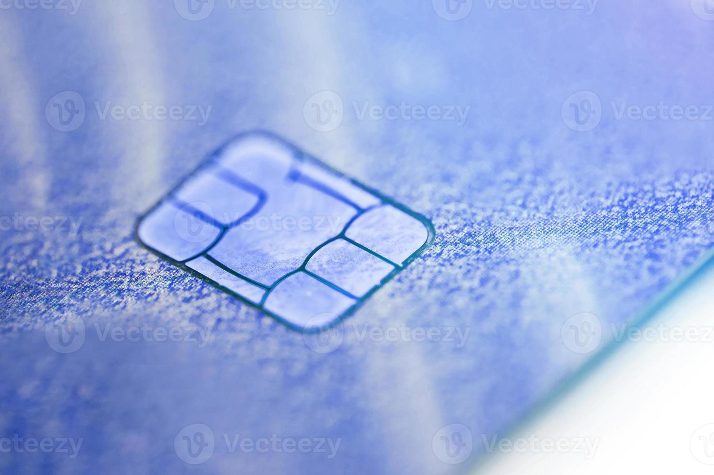 Electronic contactless credit card with selective focus microchip. Macro of a credit card. photo