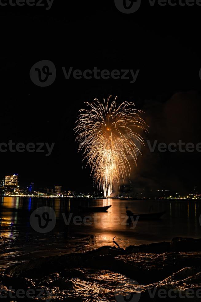 Abstract colored firework background light up the sky with dazzling display photo