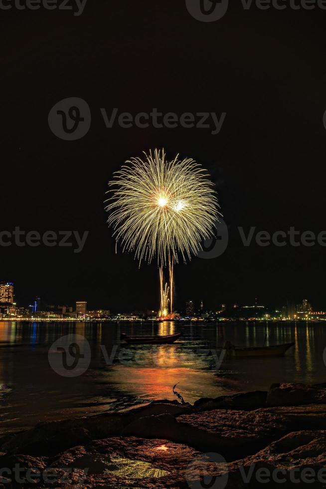 Abstract colored firework background light up the sky with dazzling display photo