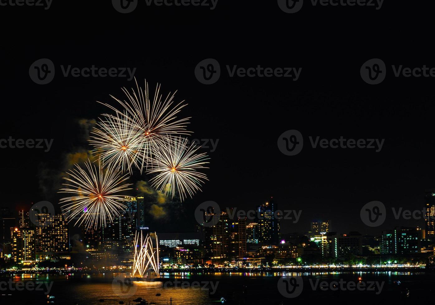 Abstract colored firework background light up the sky with dazzling display photo