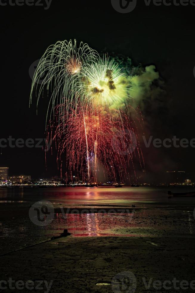Abstract colored firework background light up the sky with dazzling display photo