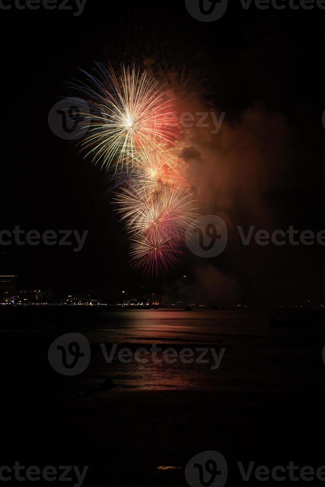 Abstract colored firework background light up the sky with dazzling display photo