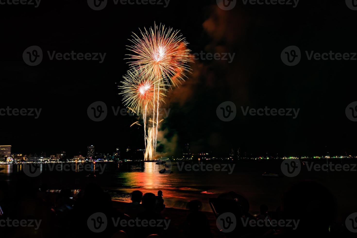 Abstract colored firework background light up the sky with dazzling display photo