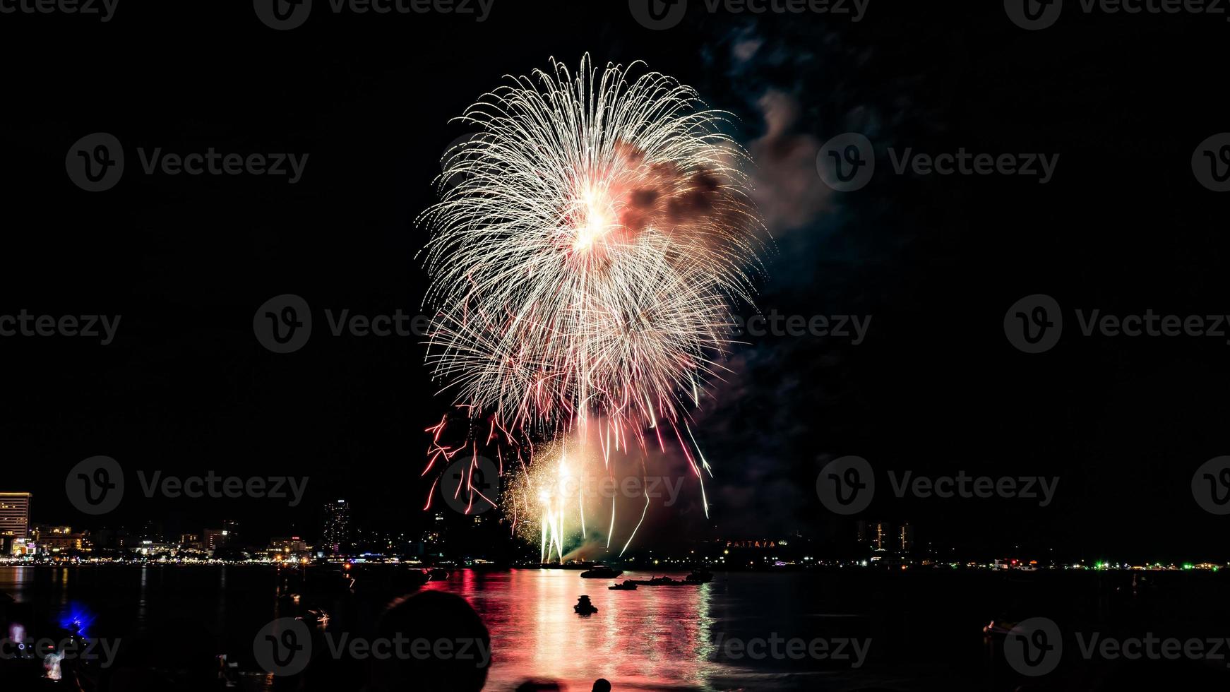 Abstract colored firework background light up the sky with dazzling display photo