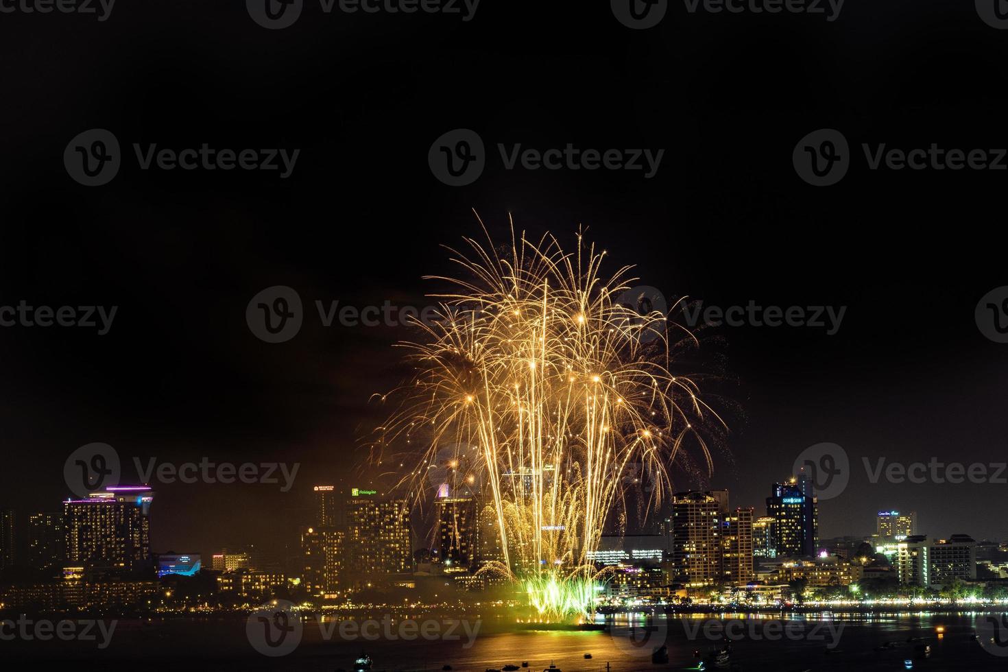 Abstract colored firework background light up the sky with dazzling display photo