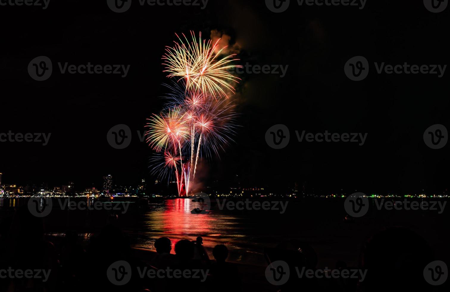 Abstract colored firework background light up the sky with dazzling display photo