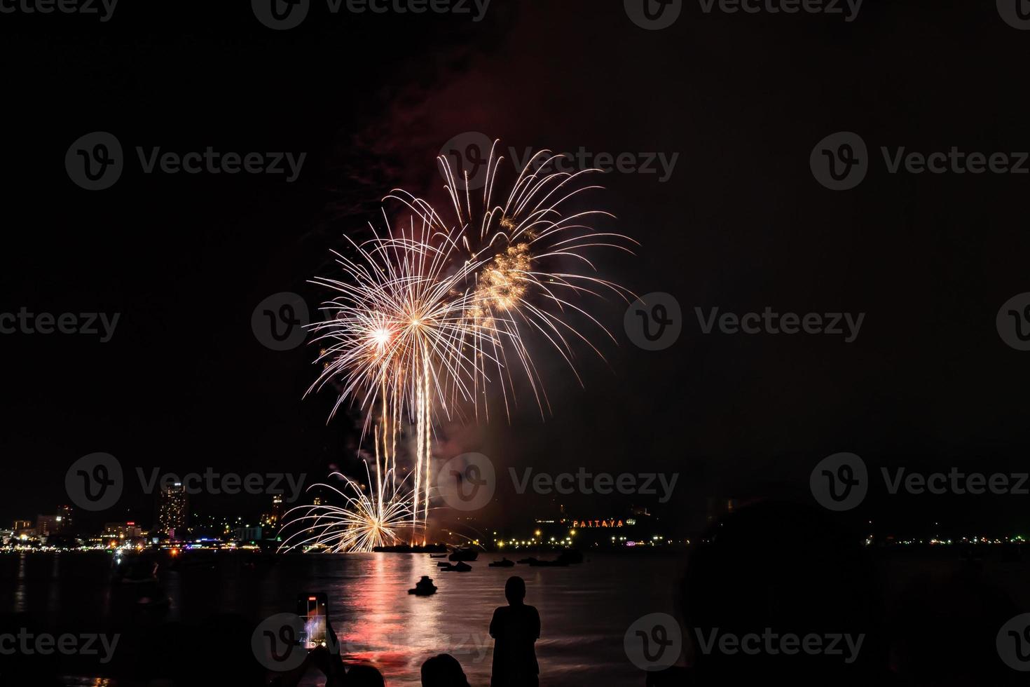 Abstract colored firework background light up the sky with dazzling display photo