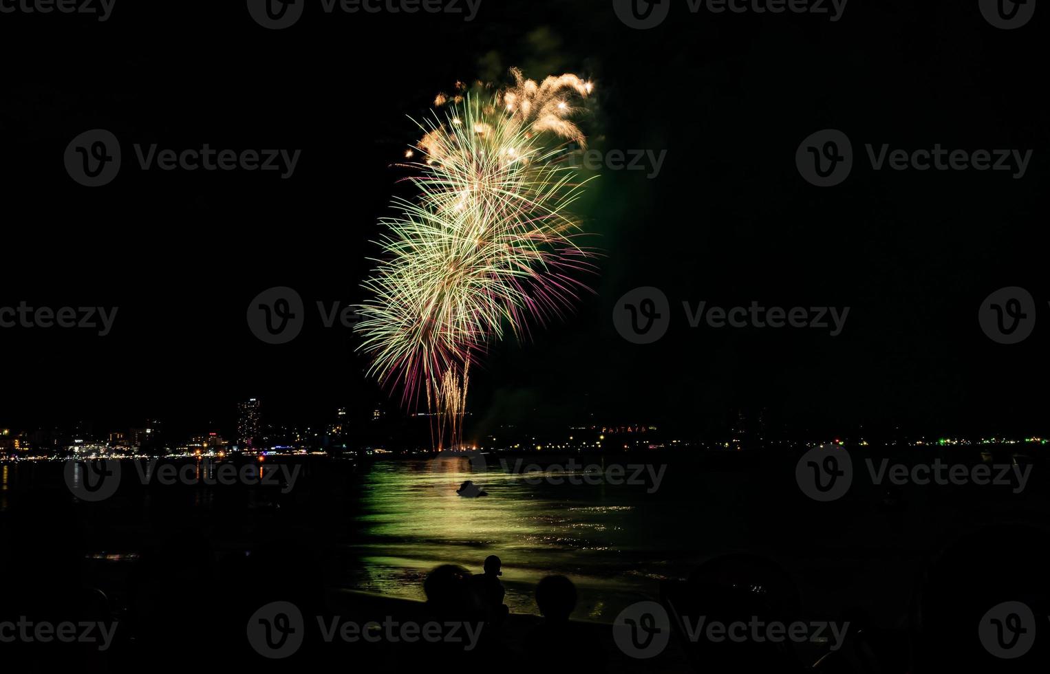 Abstract colored firework background light up the sky with dazzling display photo