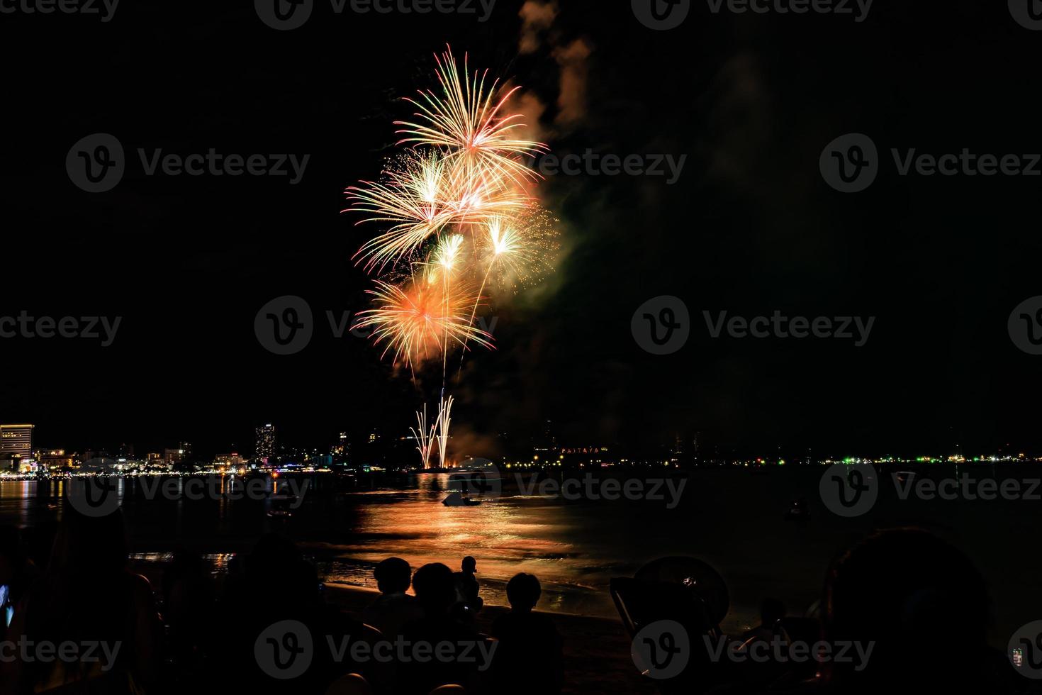Abstract colored firework background light up the sky with dazzling display photo