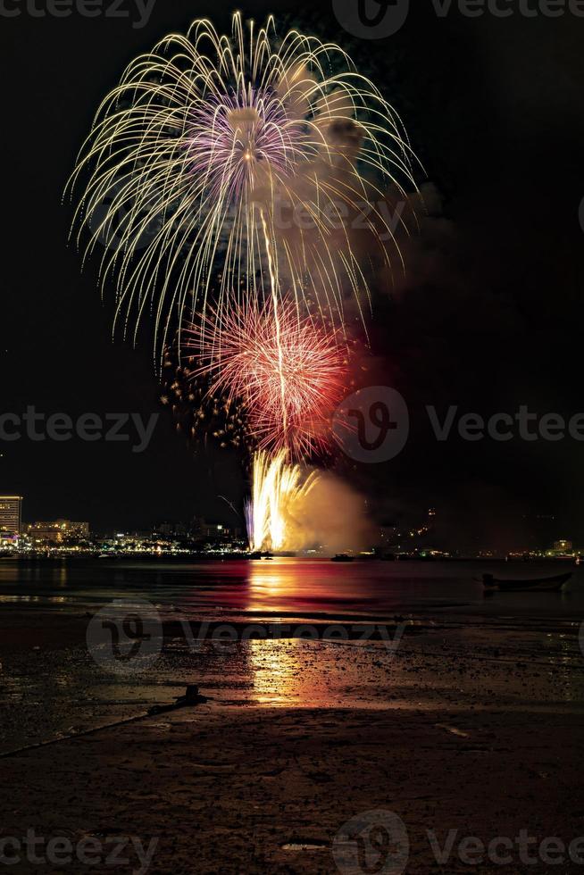 Abstract colored firework background light up the sky with dazzling display photo
