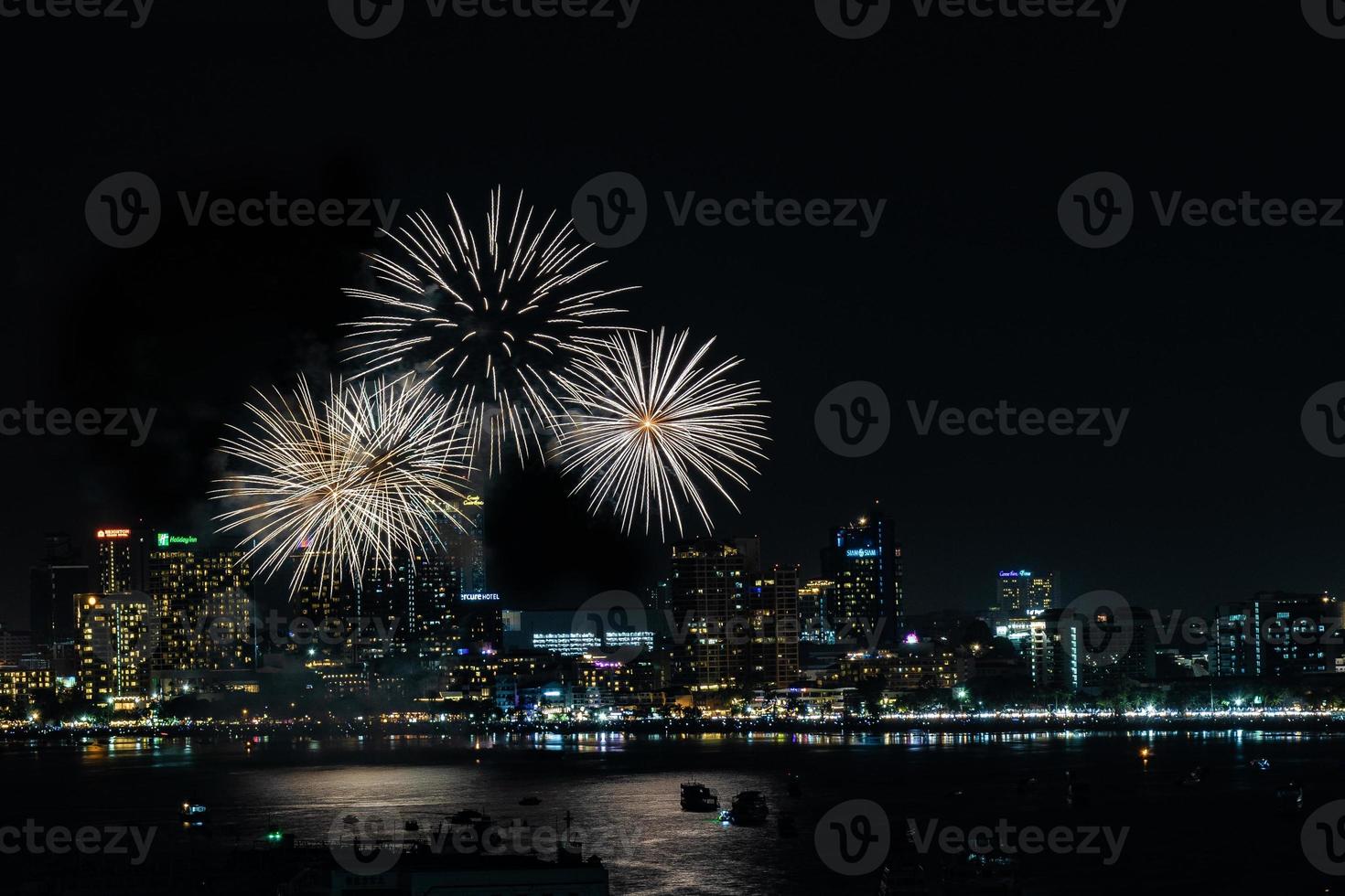 Abstract colored firework background light up the sky with dazzling display photo