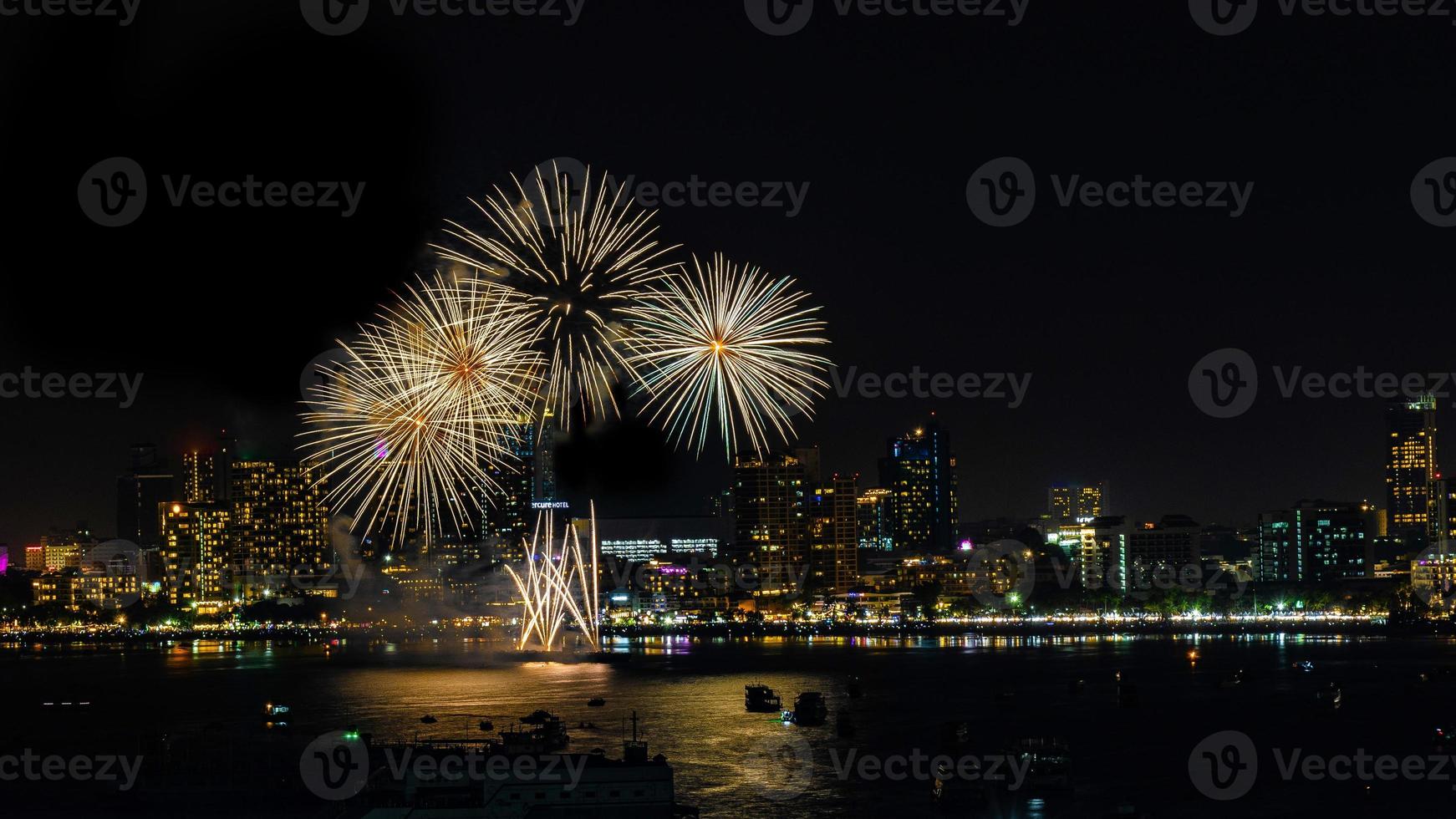 Abstract colored firework background light up the sky with dazzling display photo