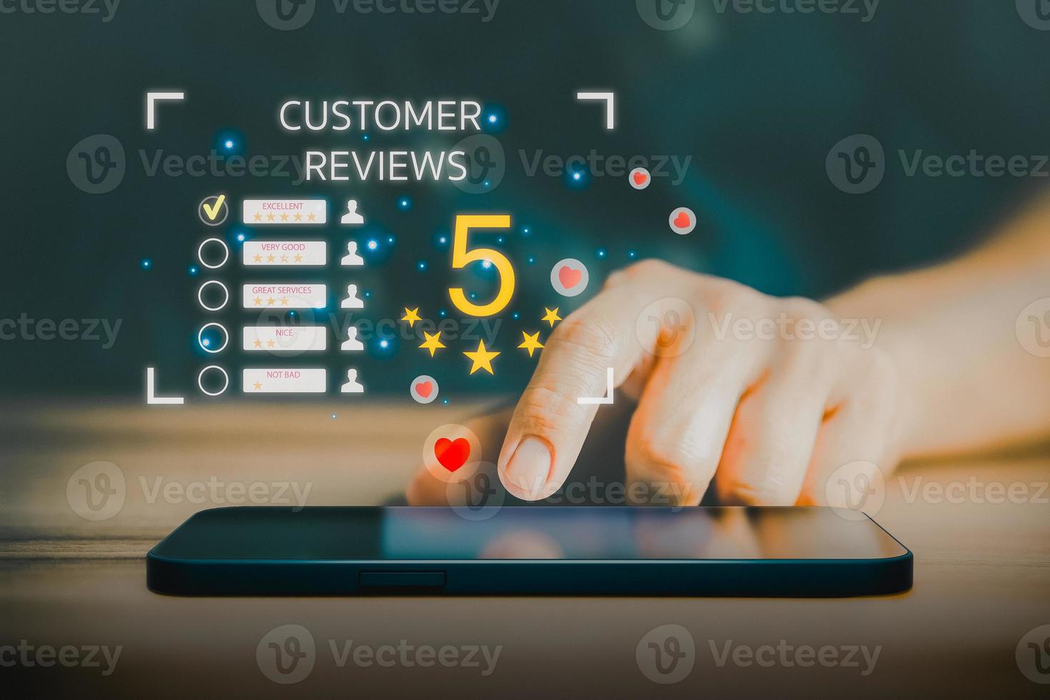 Man using a mobile phone or smartphone with popup five star icon for feedback review satisfaction service, testimonial. Customer service experience and business satisfaction survey. photo