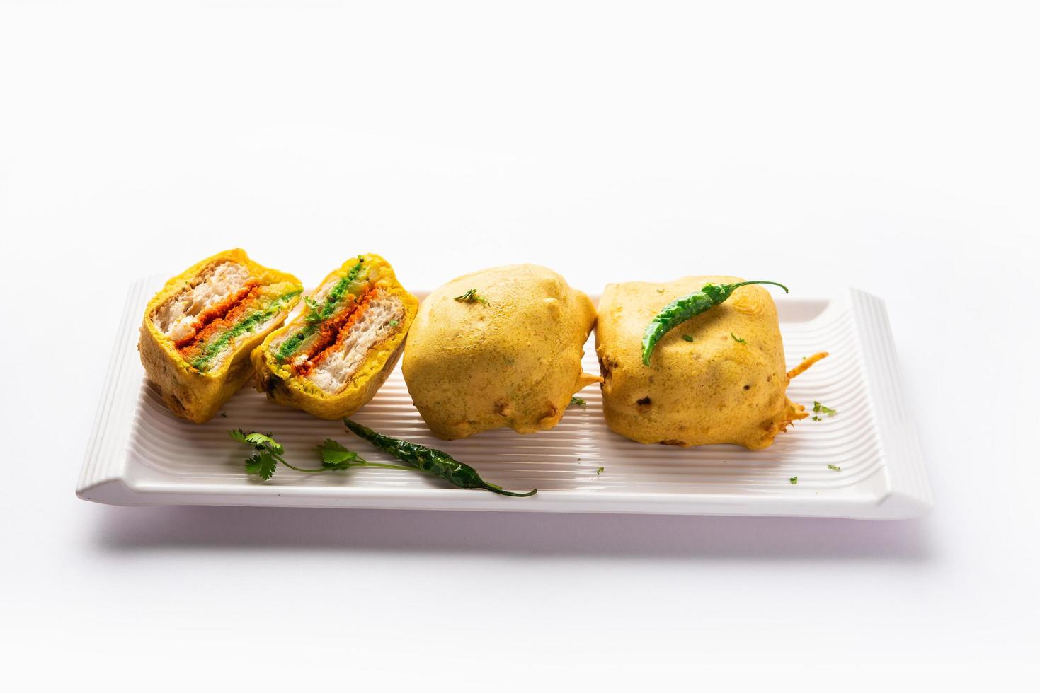 Ulta Vada Pav is made with a spicy potato stuffed bun, called pav inside vada, inside out vada pav photo
