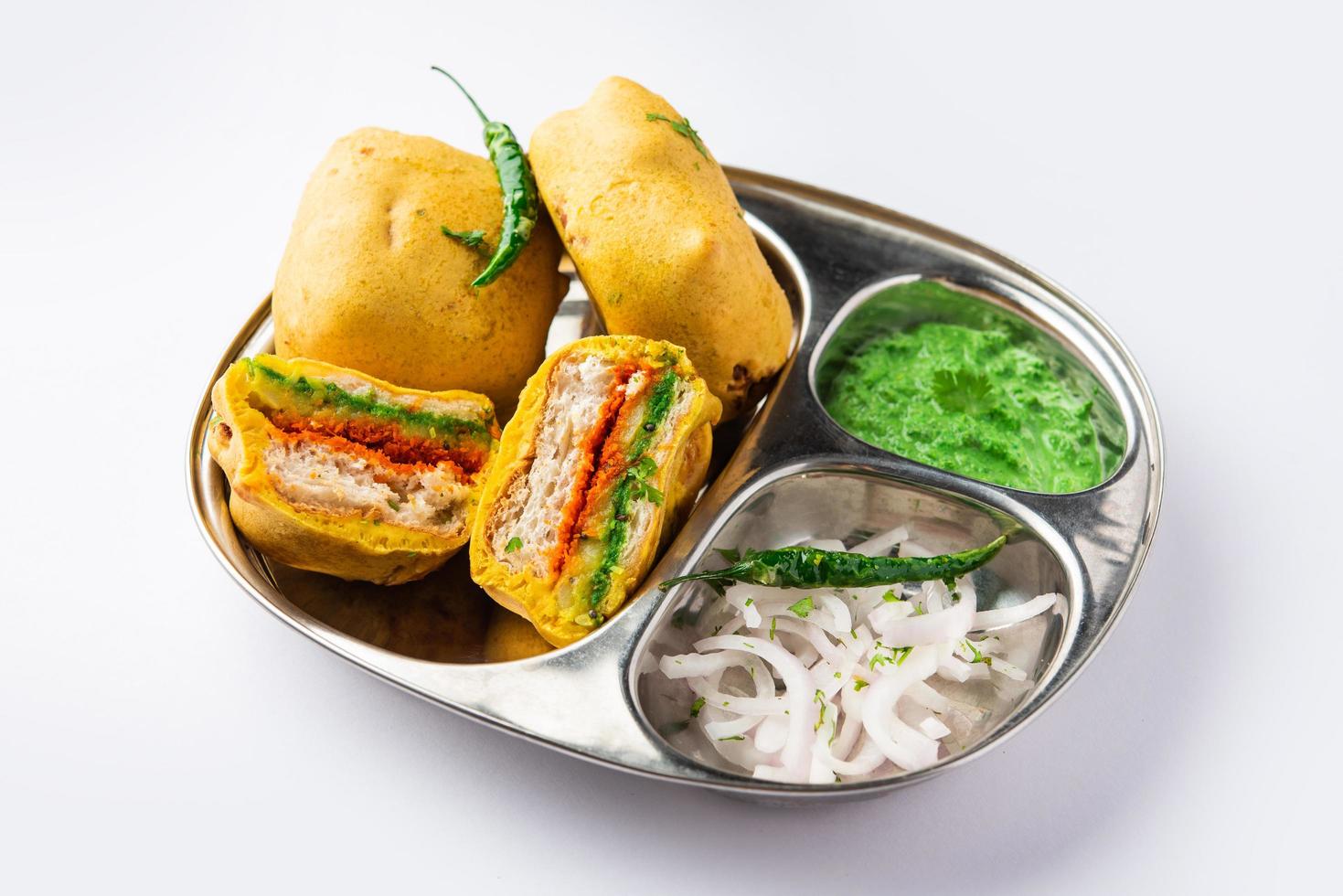 Ulta Vada Pav is made with a spicy potato stuffed bun, called pav inside vada, inside out vada pav photo