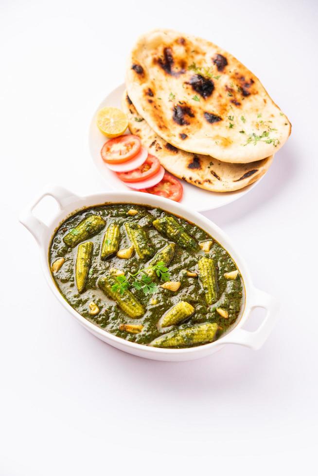 palak baby corn sabzi also known as spinach makai curry served with rice or roti, Indian food photo