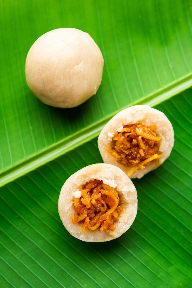 kozhukatta or kolukattai pidi is Steamed dumplings made with rice flour, filling coconut, jaggery photo