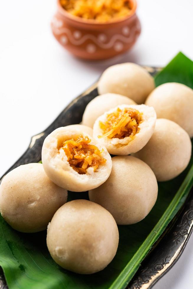 kozhukatta or kolukattai pidi is Steamed dumplings made with rice flour, filling coconut, jaggery photo