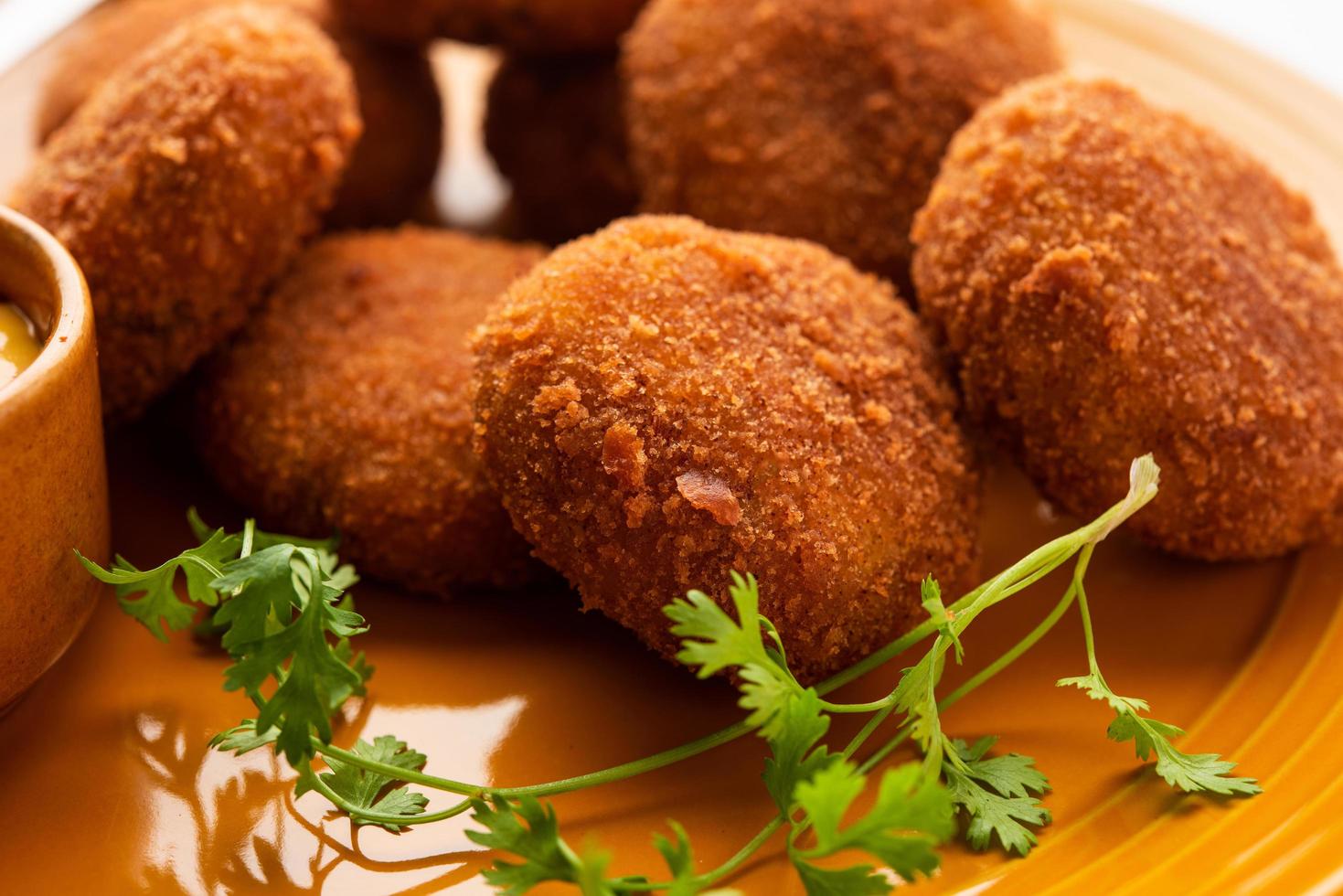 Macher Chop - Bengali style fish cutlet or pakora, a popular festival snack from west Bengal photo