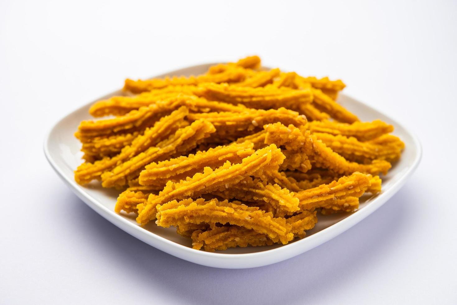 Bhajni chakli sticks or crunchy murukku snack made using diwali festival, favourite munching food photo