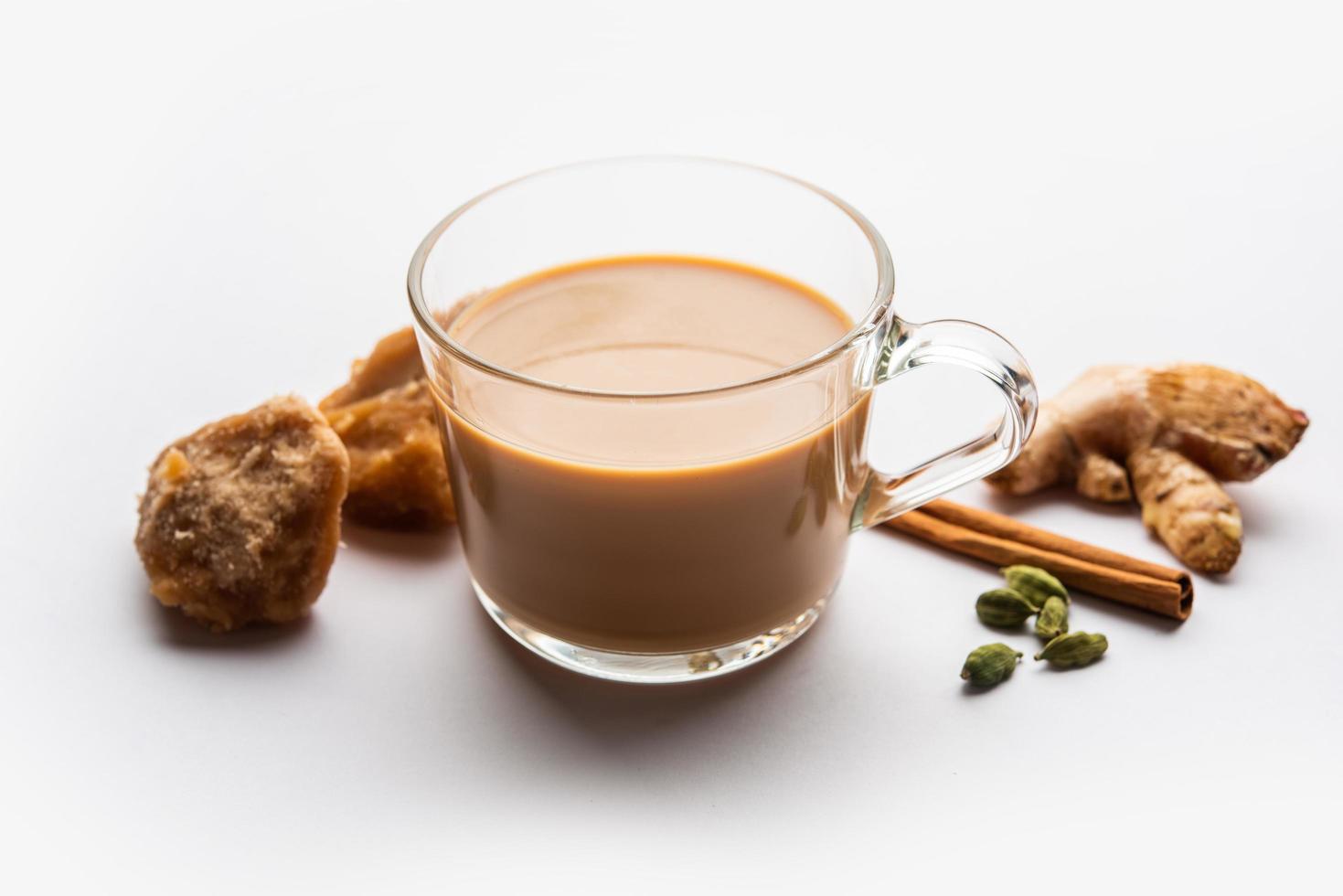 Jaggery tea or Gur ki chai with ingredients like gud, ginger or adrak, green cardamom and cinnamon photo