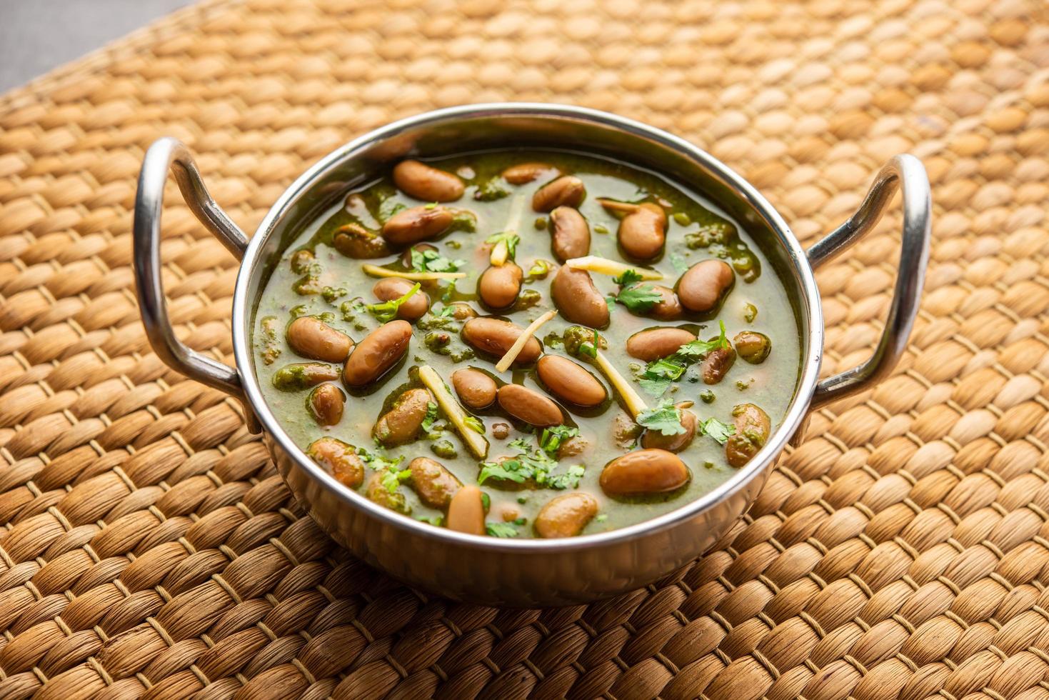 Palak rajma Masala is an Indian curry prepared with red kidney beans and spinach cooked with spices photo