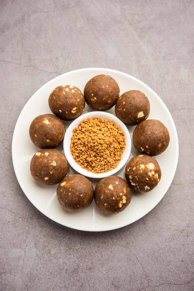 Fenugreek or methi ke Laddu, laddo or laddoo or sweet mithai balls for boosting immunity in winters photo