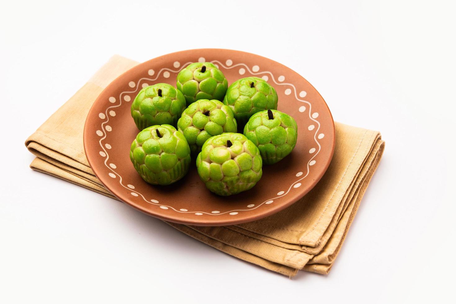 Sitafal peda or pera or custard apple shape designer sweet mithai barfi or burfi photo