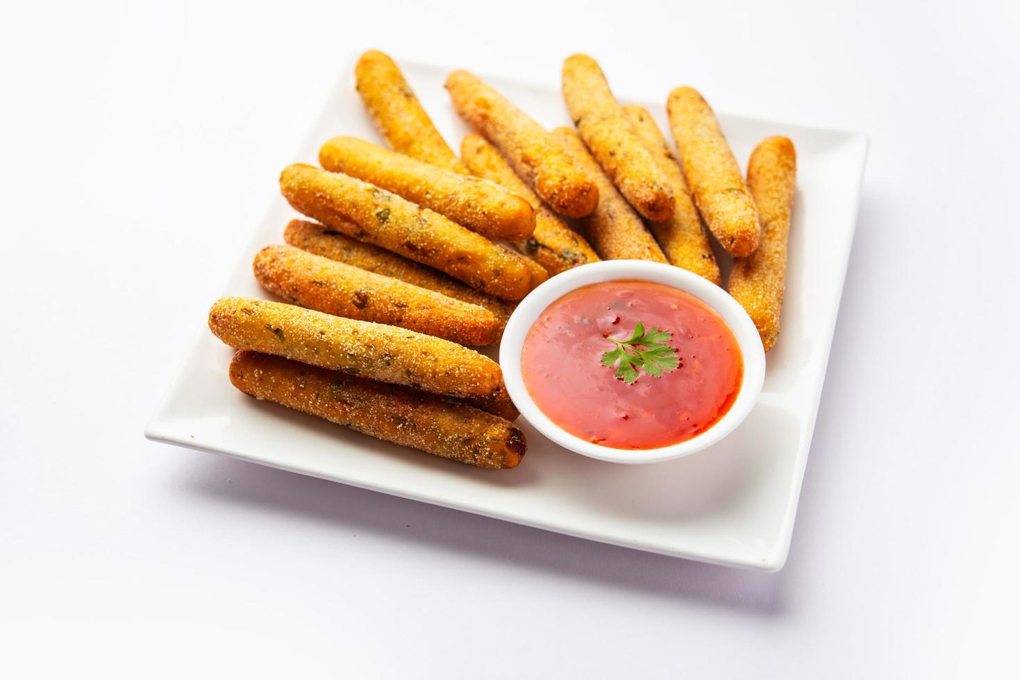 crispy Rava Aloo fingers or Potato semolina fried finger sticks served with ketchup photo