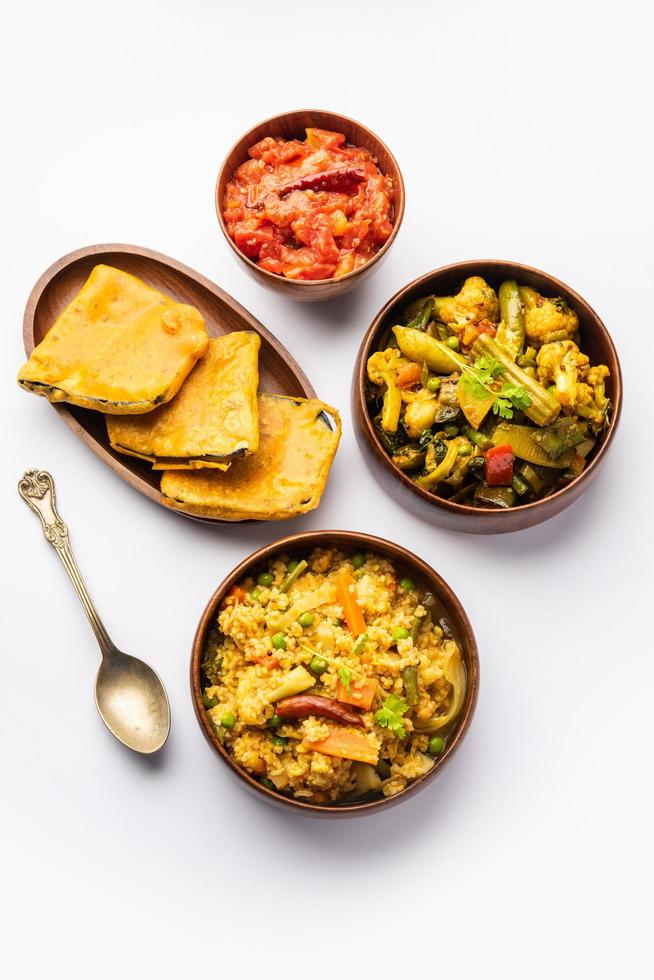 Bengali Bhog food for Indian Hindu Durga Puja or pooja festival. Khichadi, labra, tomato chutney photo