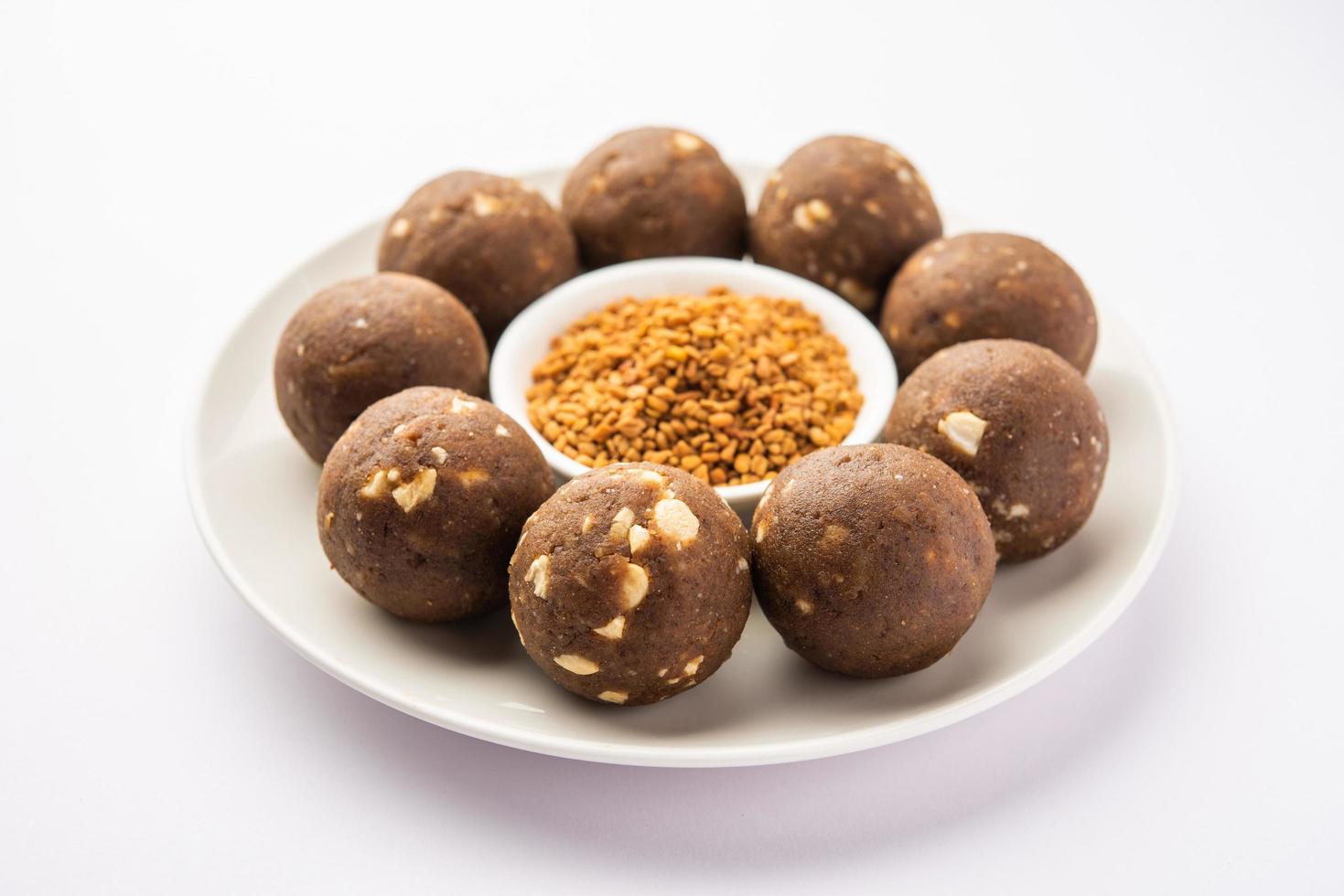 Fenugreek or methi ke Laddu, laddo or laddoo or sweet mithai balls for boosting immunity in winters photo