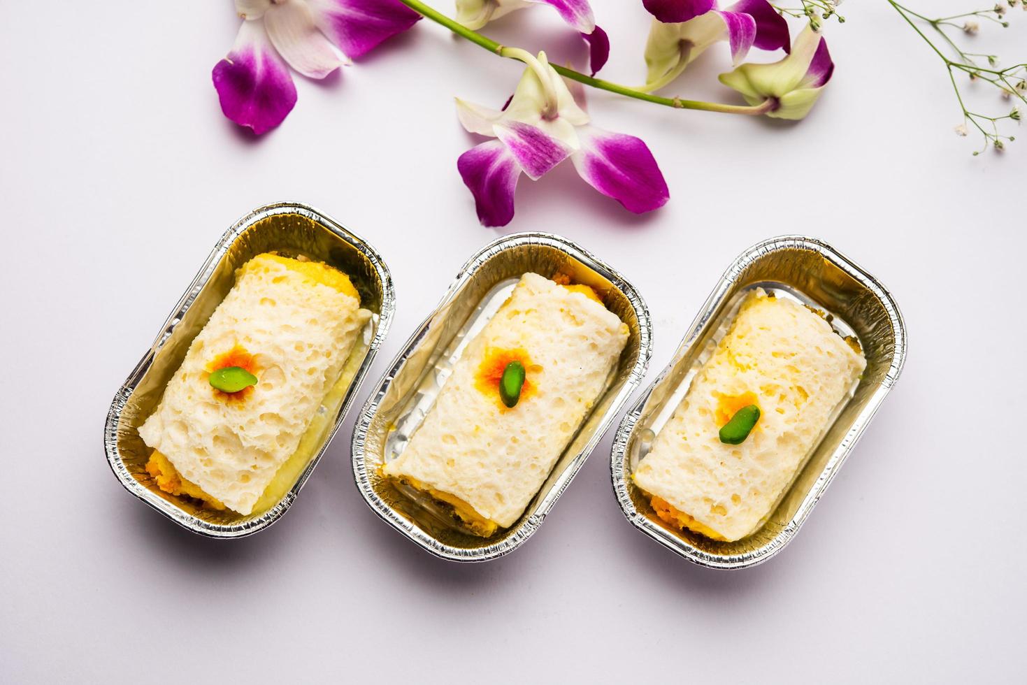 Malai Chop or Cream sandwich made using filling Rasgulla or Gulab jamun sweet is a Bengali sweet photo