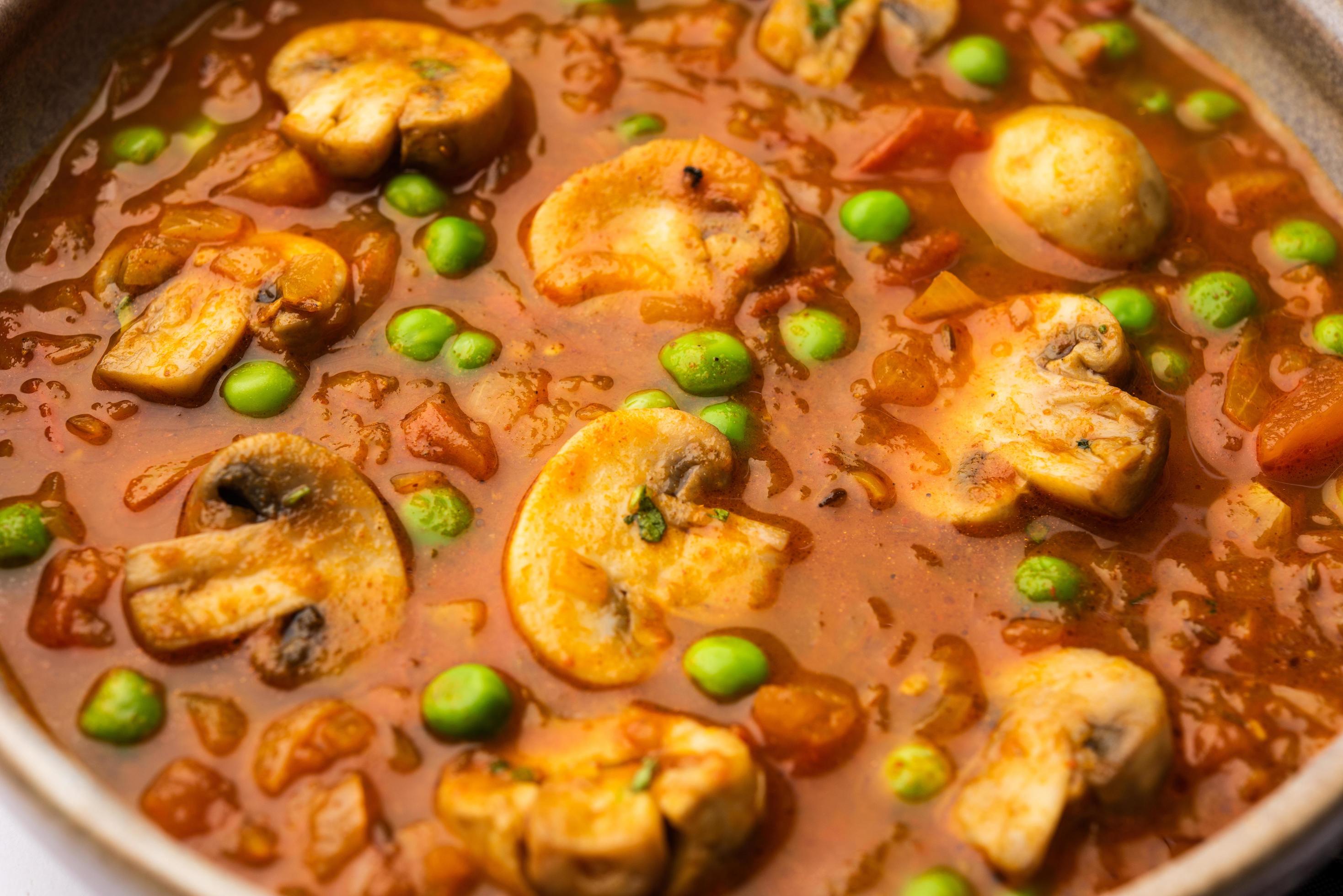 Mushroom and Pea Curry with Roasted Garlic, Indian food served in a