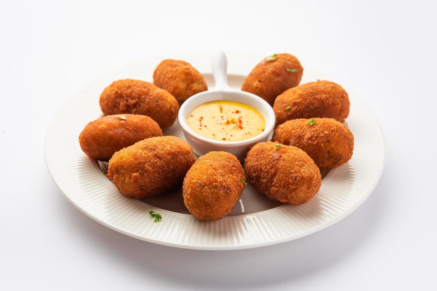 Macher Chop - Bengali style fish cutlet or pakora, a popular festival snack from west Bengal photo