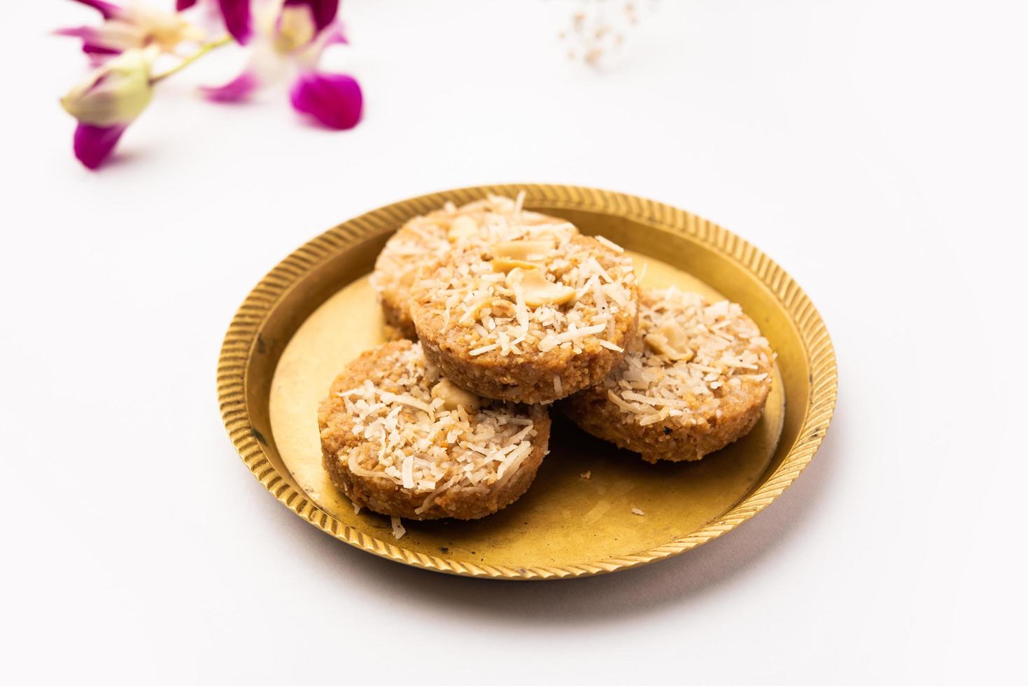 Amrit peda or Amrut pedha or pera is an Indian sweet made from milk and sugar with coconut topping photo