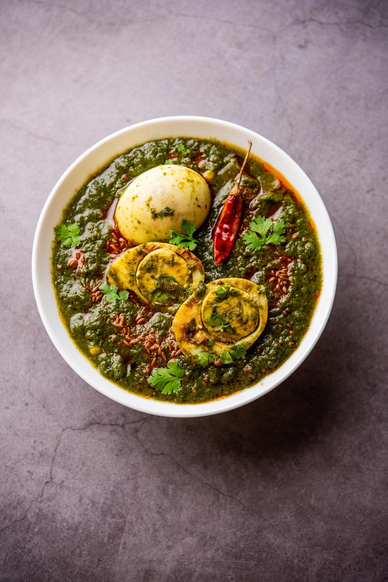 Spinach egg curry is an Indian non vegetarian dish made using palak