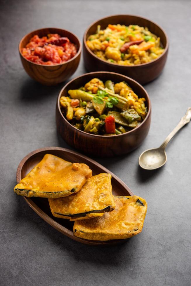 Bengali Bhog food for Indian Hindu Durga Puja or pooja festival. Khichadi, labra, tomato chutney photo