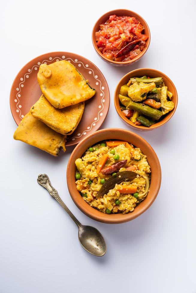 Bengali Bhog food for Indian Hindu Durga Puja or pooja festival. Khichadi, labra, tomato chutney photo