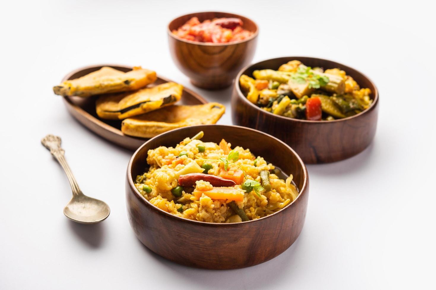 Bengali Bhog food for Indian Hindu Durga Puja or pooja festival. Khichadi, labra, tomato chutney photo