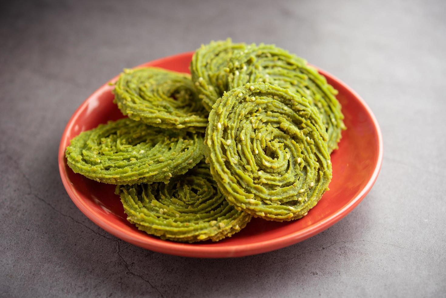 Palak Chakli or Spinach Murukku, healthy Indian festival or tea time snack photo