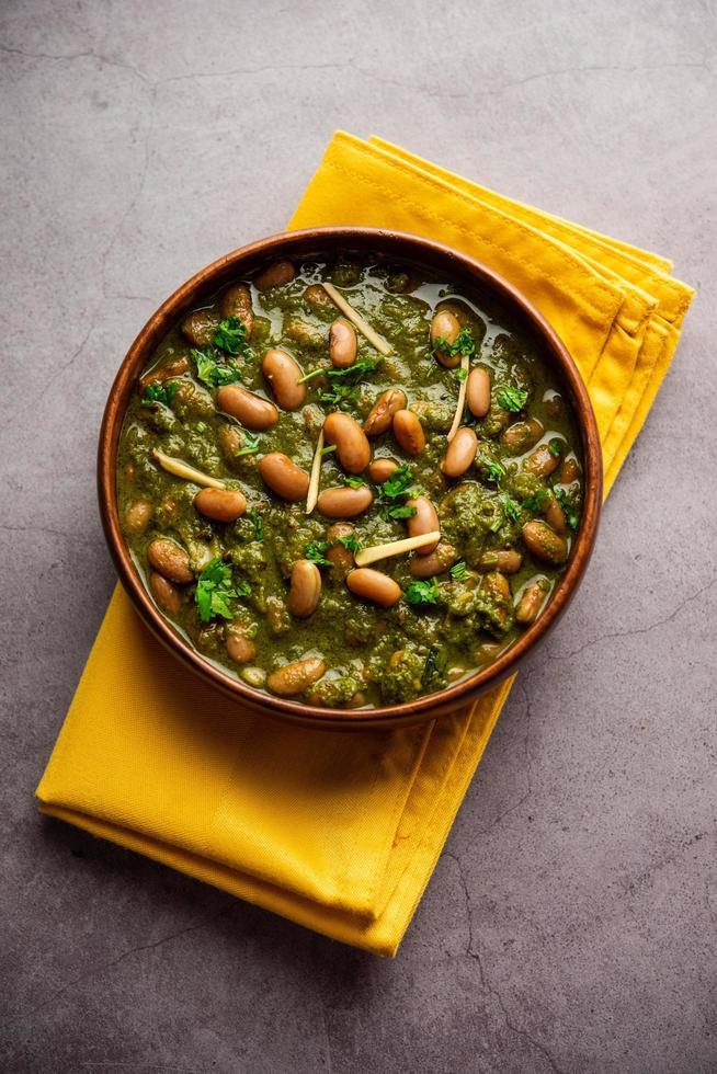 Palak rajma Masala is an Indian curry prepared with red kidney beans and spinach cooked with spices photo