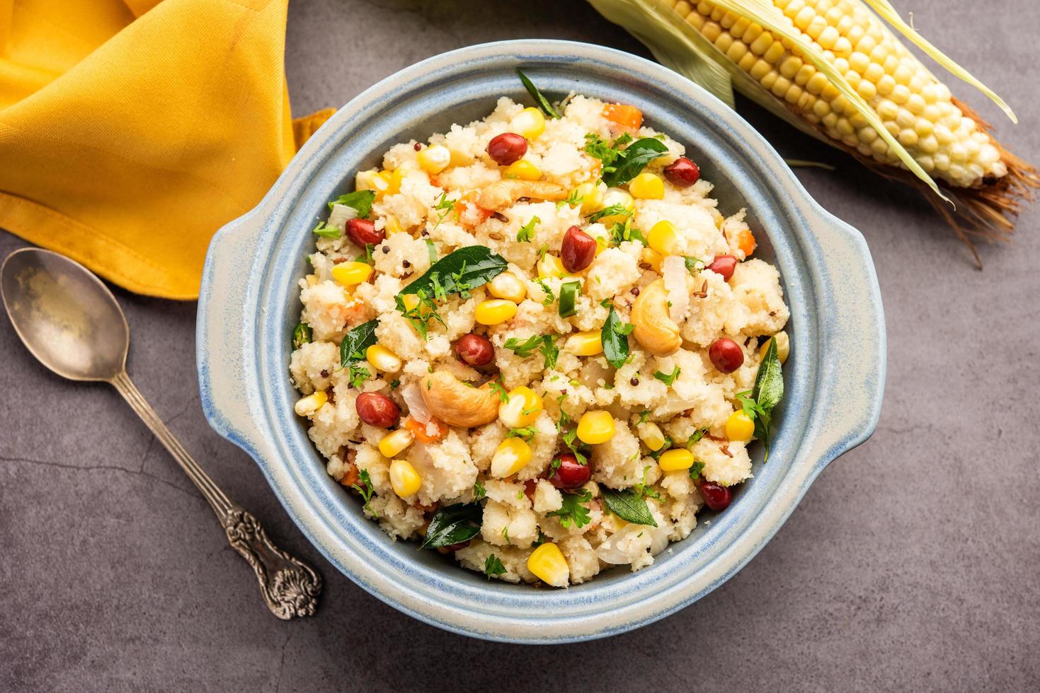Sweet Corn Upma, makai rava uppittu made using with or without semolina , healthy Indian breakfast photo