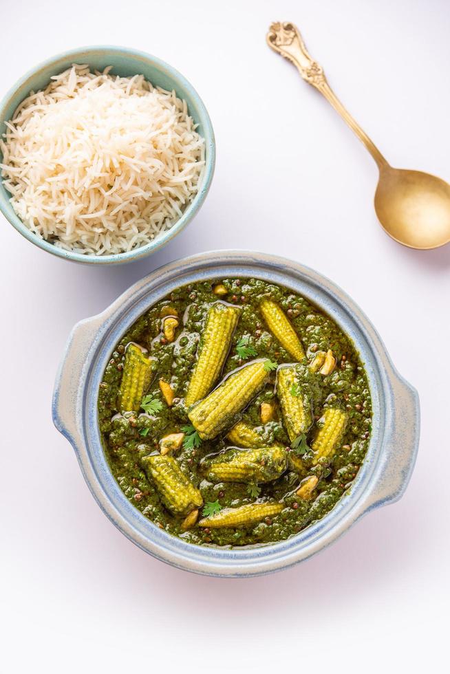 palak baby corn sabzi also known as spinach makai curry served with rice or roti, Indian food photo