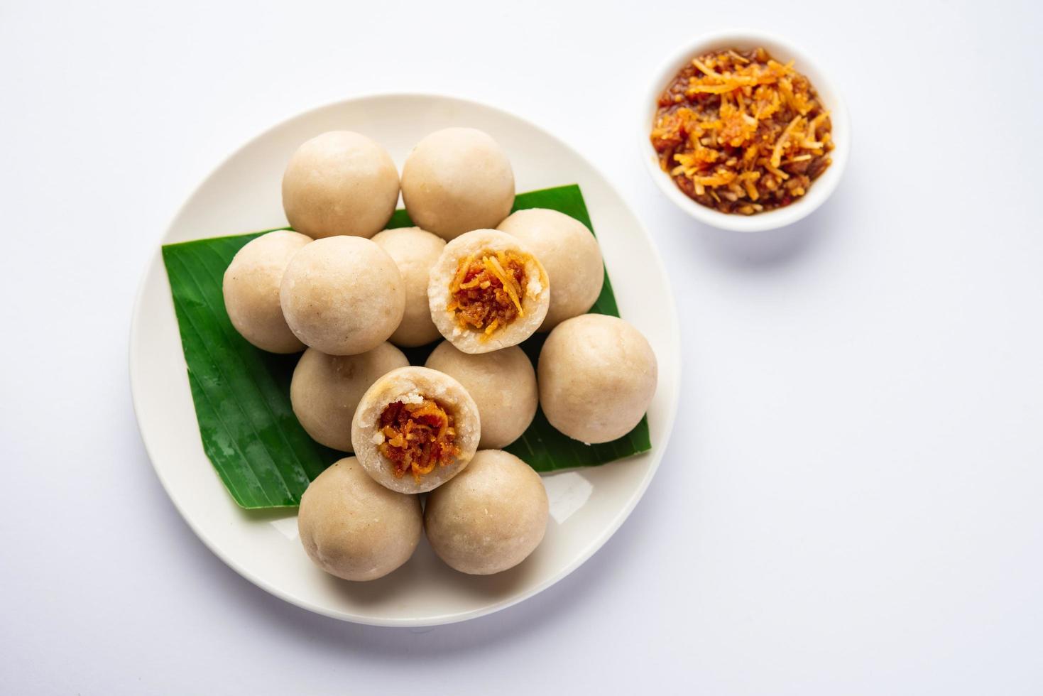 kozhukatta or kolukattai pidi is Steamed dumplings made with rice flour, filling coconut, jaggery photo