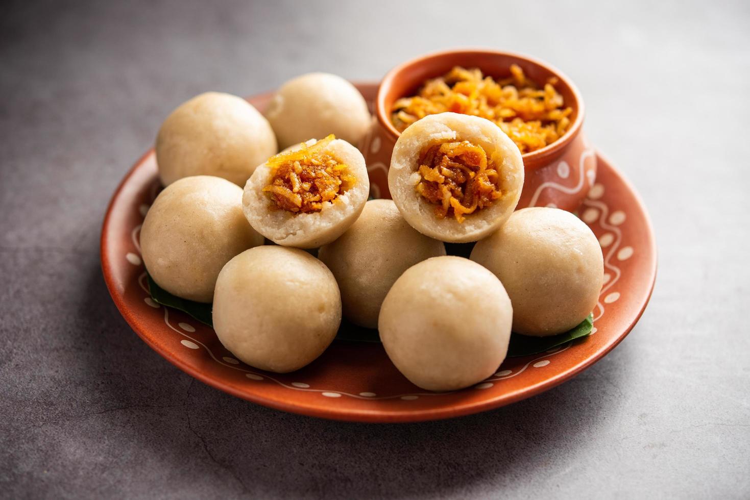 kozhukatta or kolukattai pidi is Steamed dumplings made with rice flour, filling coconut, jaggery photo