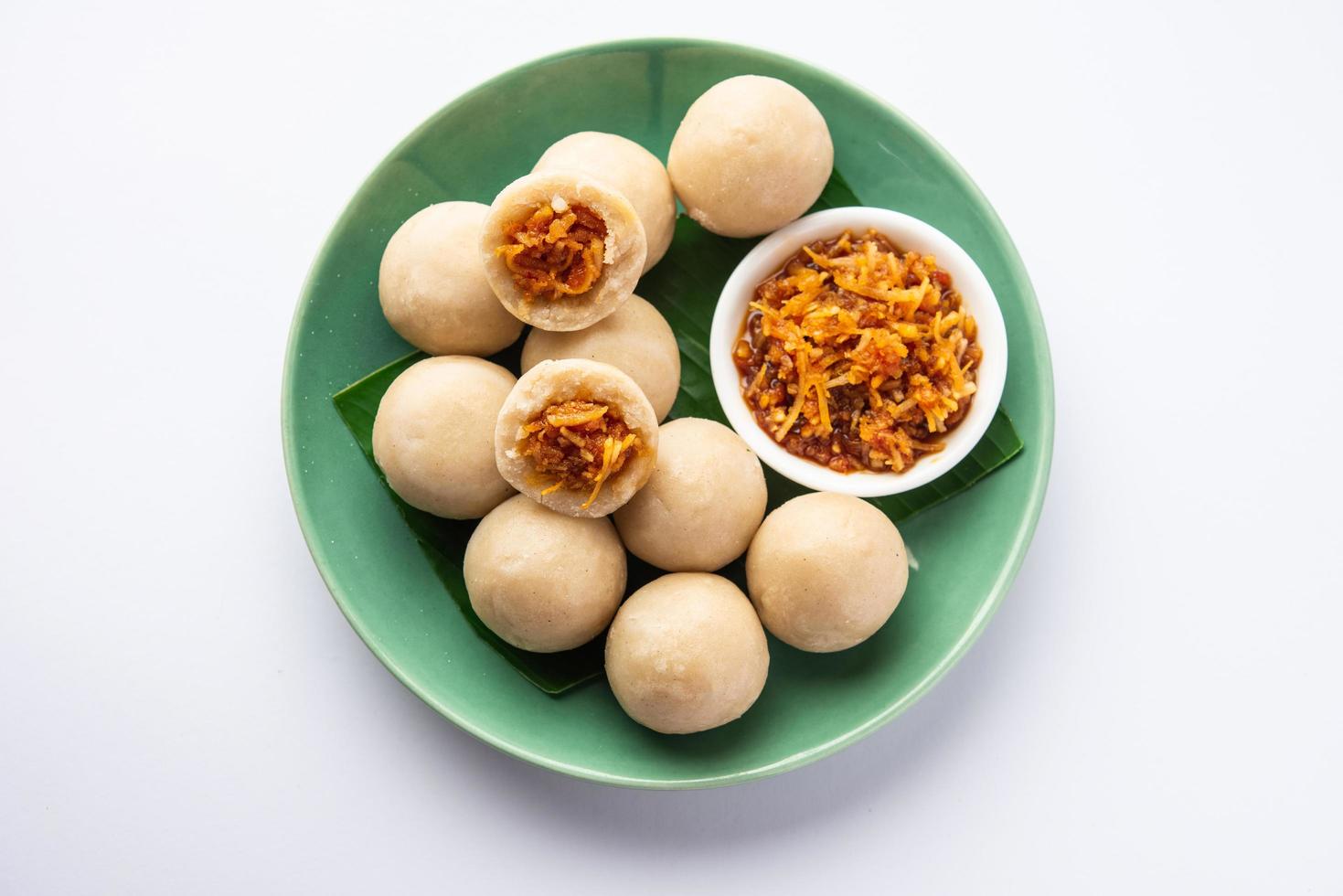 kozhukatta or kolukattai pidi is Steamed dumplings made with rice flour, filling coconut, jaggery photo